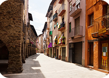 Colorful street view of Pigneto neighborhood in Rome with vibrant murals and lively cafes